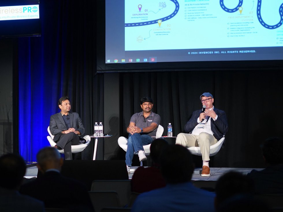 Three engineers presenting at IEEE milestone recognition ceremony