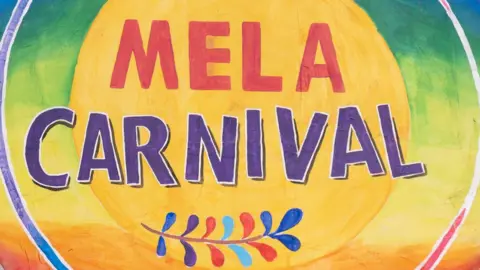 Bright carnival canvas with Mela Carnival text in red and purple